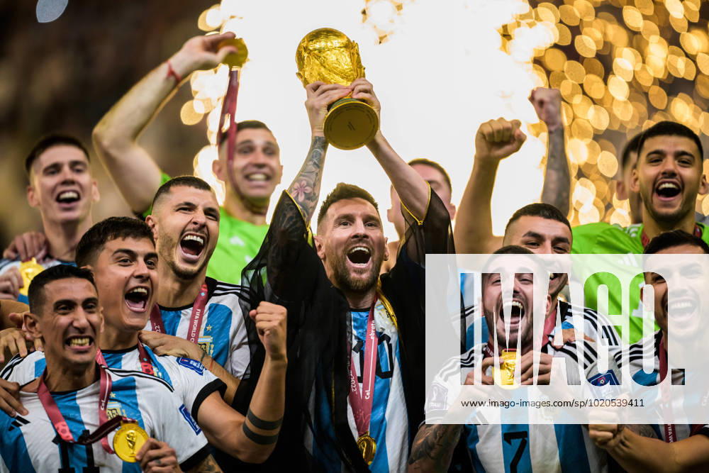 Lionel Messi of Argentina hoists the World Cup trophy as the team celebrate winning the FIFA World Cup 2022 final between Argentina and France on December 18, 2022 in Doha Photo Joel Marklund BILDBYRAN code JM JM0415 bbeng football football soccer fotball vm fotbols vm fotball vm fotbols world cup 2022 fifa world cup 2022 final argentina france france jubel world cup gold trophy topx,