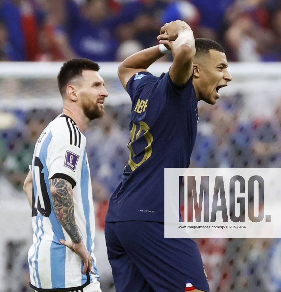 Football World Cup in Qatar France s Kylian Mbappe (R) shouts after scoring a goal from the penalty spot to complete a hat-trick during the second half of extra time in the World Cup football final against Argentina at Lusail Stadium in Lusail, Qatar, on Dec. 18, 2022. Argentina s Lionel Messi can be seen next to him. A14AA0001378026P