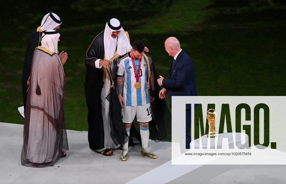 FOOTBALL World Cup 2022 Final Argentina France 18 12 2022 Tamim bin Hamad Al Thani Emir of Qatar puts a cape Bischt around Lionel Messi Fifa President Gianni Infantino shows great enthusiasm