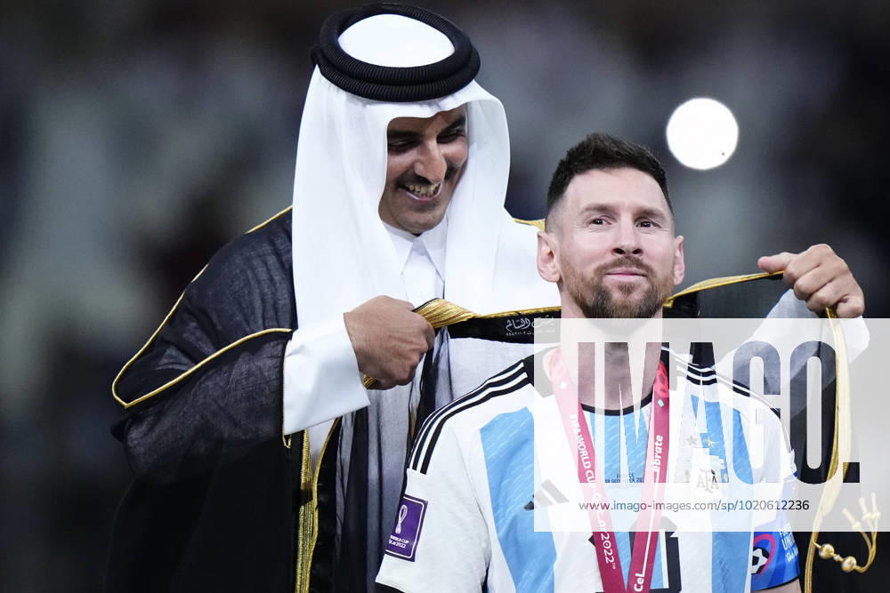 Argentina v France: Final - FIFA World Cup, WM, Weltmeisterschaft, Fussball Qatar 2022 Qatars Emir Tamim Bin Hamad Al Thani puts the besht to Lionel Messi right winger of Argentina and Paris Saint-Germain after the FIFA World Cup Qatar 2022 Final match between Argentina and France at Lusail Stadium on December 18, 2022 in Lusail City, Qatar. Lusail City Qatar