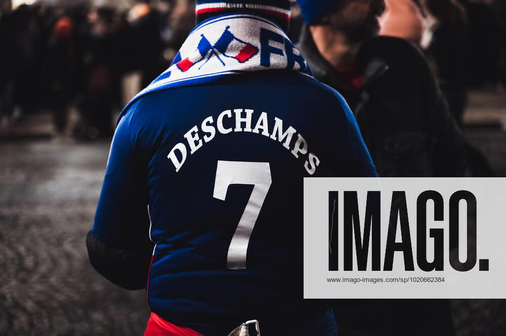 French Football Team Fans Greet The Players On The Place De La Concorde In Paris A French football team fan wearing a Deschamps jersey on the Place de la Concorde to welcome the players on the balcony of the Crillon hotel after their return from Qatar after their defeat against Argentina in the World Cup final in Paris on December 19, 2022. Paris France