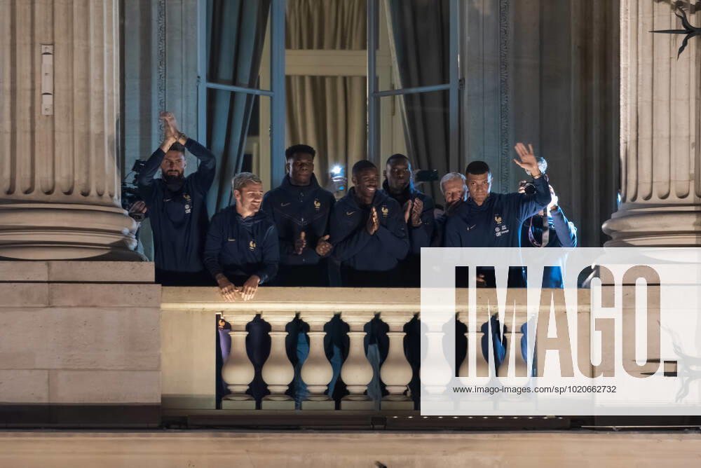 French Football Team Fans Greet The Players On The Place De La Concorde In Paris French football team players including Kylian Mbappe, Aurelien Tchouameni, Antoine Griezman and Olivier Giroud wave to the crowd as French football team supporters gather on the Place de la Concorde with French flags to welcome the players on the balcony of the Hotel de Crillon after their return from Qatar following their defeat by Argentina in the World Cup final in Paris on December 19, 2022. Paris France