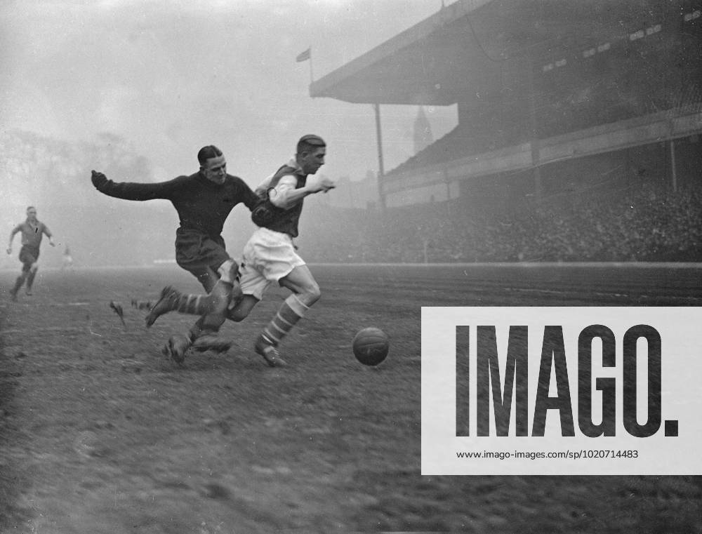 Football Arsenal V Wolverhampton at Highbury . Wildman , the Wolves goalie , pulls down Drake Arsenal s new centre . 24 March 1934 United Kingdom England