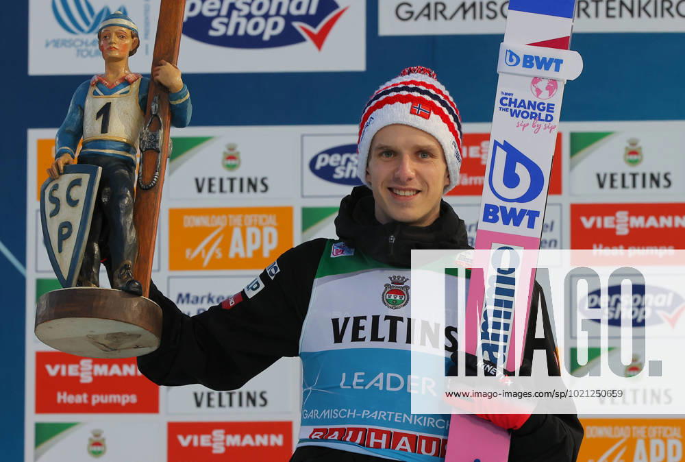 KW52 Ski jumping, Skispringen, Ski, nordisch - FIS WC Garmisch-Partenkirchen GARMISCH-PARTENKIRCHEN,GERMANY,01.JAN.23 - NORDIC SKIING, SKI JUMPING - FIS World Cup, Four Hills Tournament, large hill, award ceremony. Image shows the rejoicing of Halvor Egner Granerud (NOR). keywords: trophy. GEPAxpictures xThomasxBachun