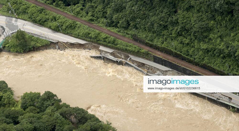 Torrential rain in central Japan Photo taken from a Kyodo News helicopter on July 8, 2020, shows a collapsed section of national road Route 41 after torrential rain caused the Hida River in Gero in Gifu Prefecture, central Japan, to swell.
