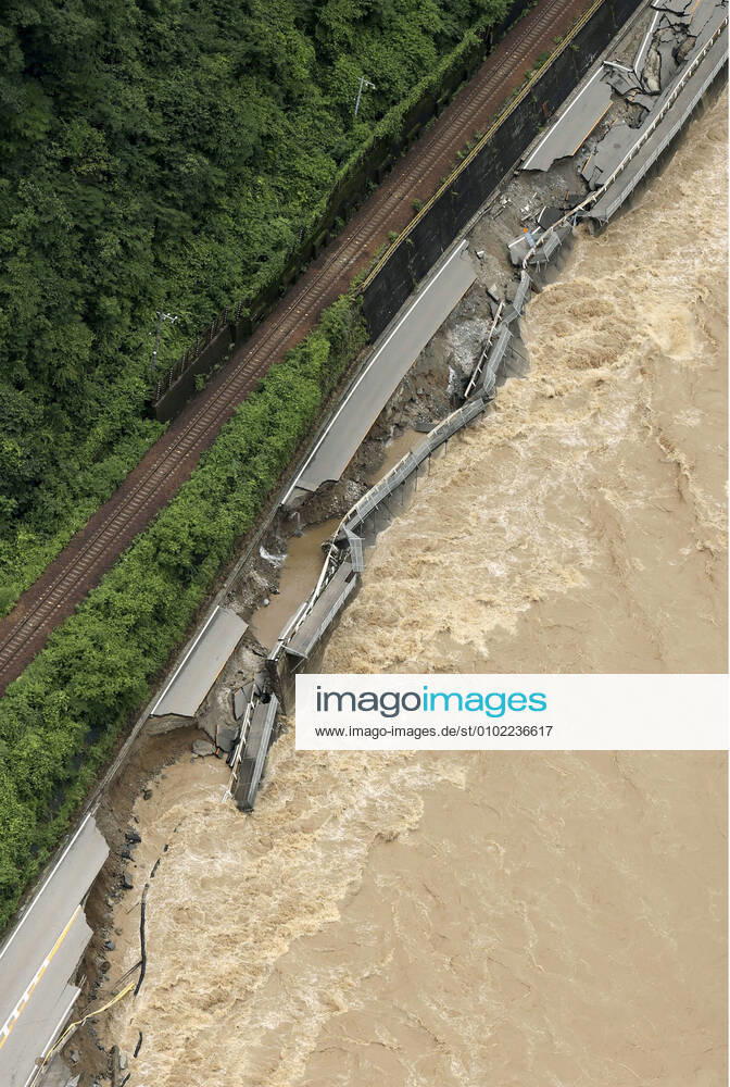 Torrential rain in central Japan Photo taken from a Kyodo News helicopter on July 8, 2020, shows a collapsed section of national road Route 41 after torrential rain caused the Hida River in Gero in Gifu Prefecture, central Japan, to swell.