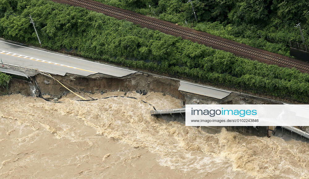 Torrential rain in central Japan Photo taken from a Kyodo News helicopter on July 8, 2020, shows a collapsed section of national road Route 41 after torrential rain caused the Hida River in Gero in Gifu Prefecture, central Japan, to swell.
