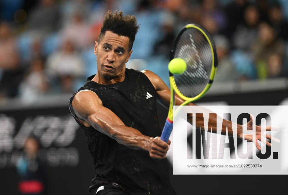TENNIS AUSTRALIAN OPEN, Michael Mmoh of the USA returns during his second round match against Alexander Zverev of Germany during the 2023 Australian Open tennis tournament at Melbourne Park in Melbourne, Thursday, January 19, 2023. ( NO ARCHIVING, , NO USE IN BOOKS WITHOUT CONSENT MELBOURNE VICTORIA AUSTRALIA
