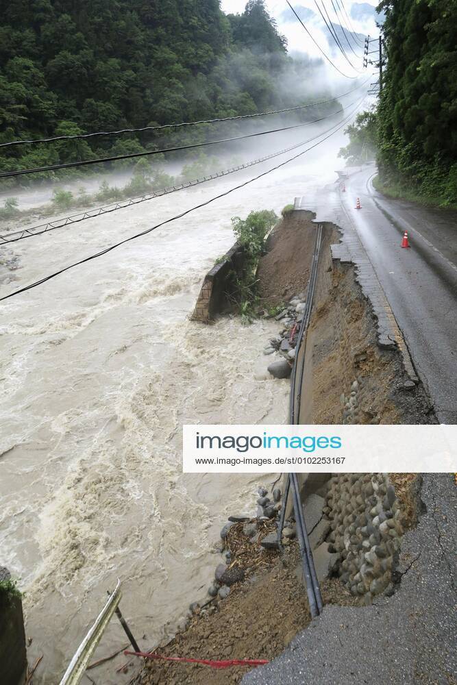 Torrential rain in central Japan Photo taken July 9, 2020, shows a collapsed section of a national road in Takayama in Gifu Prefecture, central Japan, following torrential rain.
