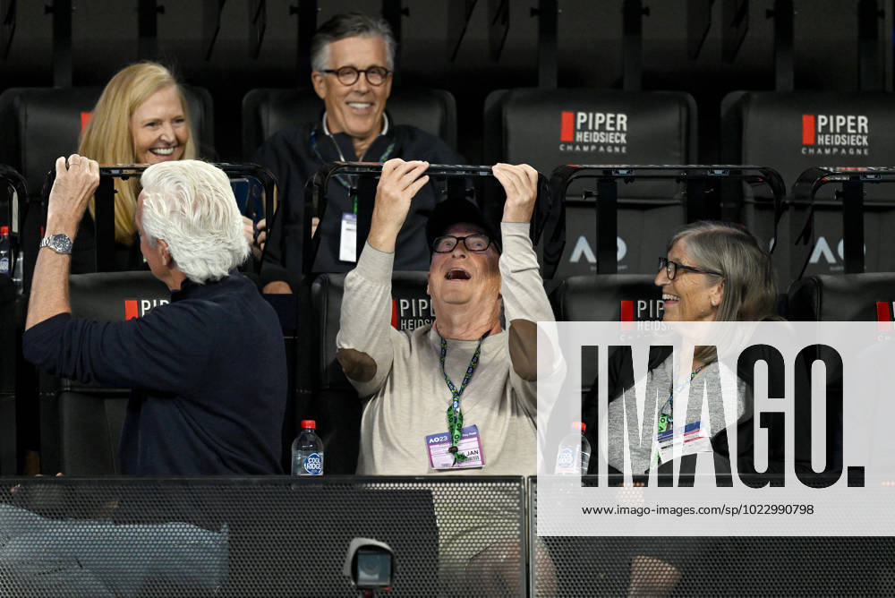TENNIS AUSTRALIAN OPEN, Bill Gates (centre) makes adjustments while spectating the semi final match between Elena Rybakina of Kazakhstan and Victoria Azarenka of Belarus at the 2023 Australian Open tennis championship at Melbourne Park in Melbourne, Thursday, January 26, 2023. ( NO ARCHIVING, , NO USE IN BOOKS WITHOUT CONSENT MELBOURNE VICTORIA AUSTRALIA