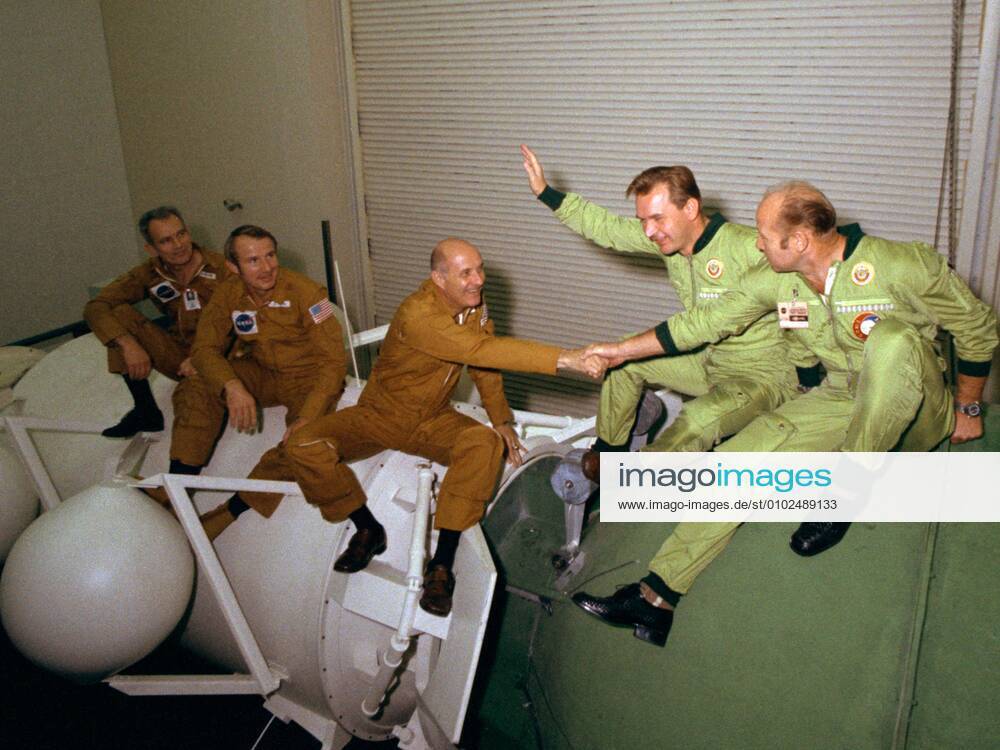 PICTURE SHOWS: The astronauts and cosmonauts sit atop mock-ups at NASA s Johnson Space Center in Houston. At left, the three Americans (left to right, Slayton, Brand and Stafford) are seated on a mock-up of the docking module designed to link the Apollo and Soyuz spacecraft. The two Soviets (Kubasov, left, and Leonov) are atop a mock-up of a Soyuz spacecraft. ... STORY COPY: ANNIVERSARY (17 July 1975): Cold War Rivals Met in Space On July 17, 1975, something momentous happened: two Cold War-rivals met in space. When their respective spacecraft rendezvoused and docked, a new era of cooperative ventures in space began. For more than a decade, American astronauts and Russian cosmonauts have been regularly living and working together in