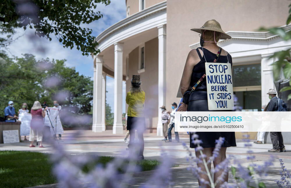 Chrysa Wikstrom, from Santa Fe, joins around 25 people for a socially distanced, face mask wearing protest of nuclear weapons outside the Roundhouse in Santa Fe, Thursday July 16, 2020. The protest led by the Los Almaos Study Group was protesting against nuclear weapons on the 75th anniversary of the first test of an atomic bomb built at Los Alamos and detonated at the Trinity Site near Alamogordo in 1945. USA - ZUMAab1_ 20200716_zaf_ab1_006
