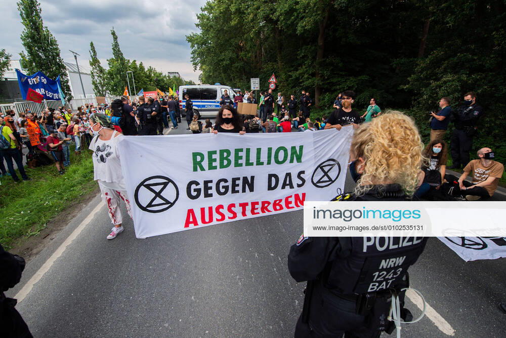 Environmental activists blockade street near Tönnies main factory Demonstrators with a sitting blockade , Rheda Wiedenbrück Nordrhein Westfalen Germany