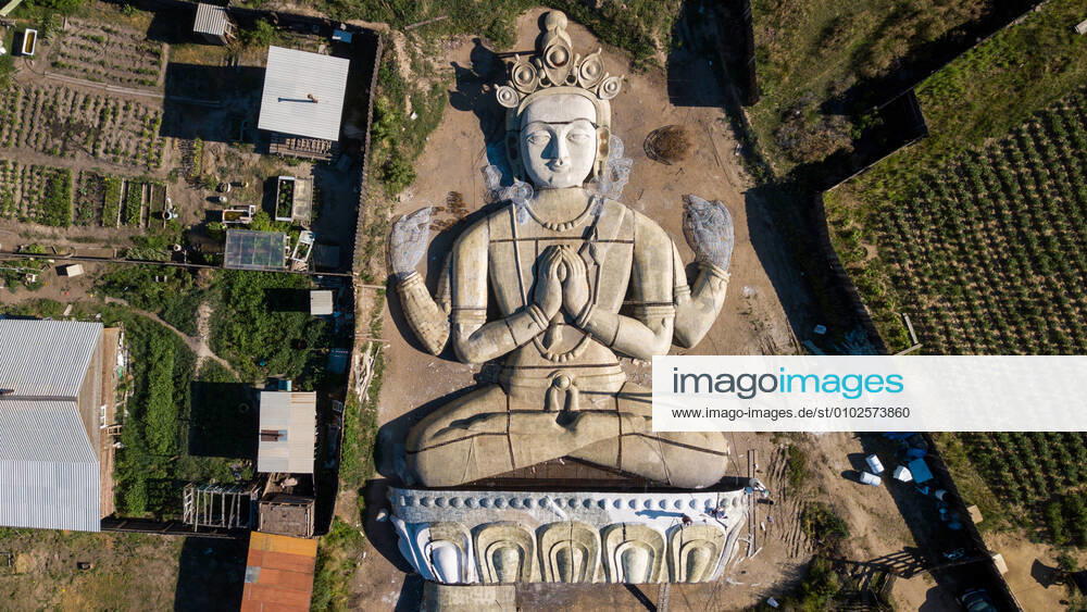 An aerial view of a statue of Bodhisattva Avalokitesvara in the yard of sculptor and monumentalist Yuri Mandaganov in Ivolginsk District. The statue is 23 meters high and 28 meters wide, its base is made of 30 tons of rebars and covered with a three-layer synthetic fiberglass cloth saturated with tar. The statue will be installed on a mountain slope by a datsan in the village of Sanaga, Zakamensk District. Andrei Ogorodnik TASS TS0E0A8D
