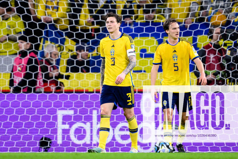 Victor Nilsson Lindelöf and Hjalmar Ekdal of Sweden look dejected during the UEFA Euro Qualifier football match between Sweden and Belgium on March 24, 2023 in Stockholm. sweden sweden a sweden belgium belgium depp,