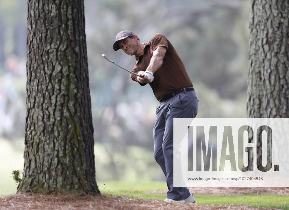 Adam Scott hits from the pine straw in the trees during the first round at the Masters tournament at Augusta National Golf Club in Augusta, Georgia on Thursday, April 6, 2023. AUG20230406216 JOHNxANGELILLO
