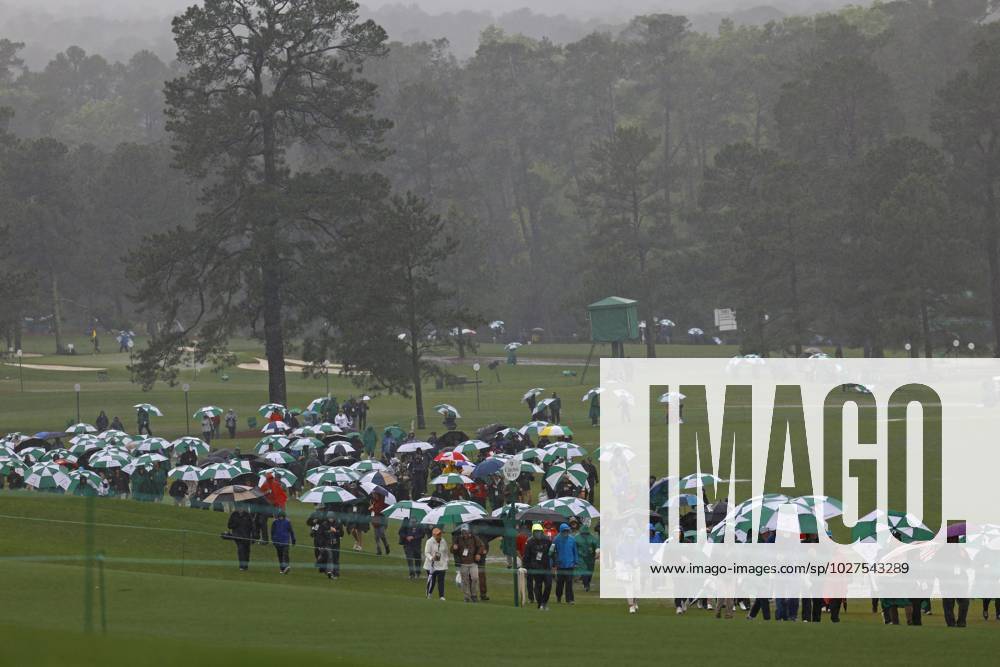 Golf: Masters Tournament Spectators leave the grounds after play was suspended for the day due to bad weather during the third round of the Masters Tournament at Augusta National Golf Club in Augusta, Georgia, on April 8, 2023. A14AA0001414708P
