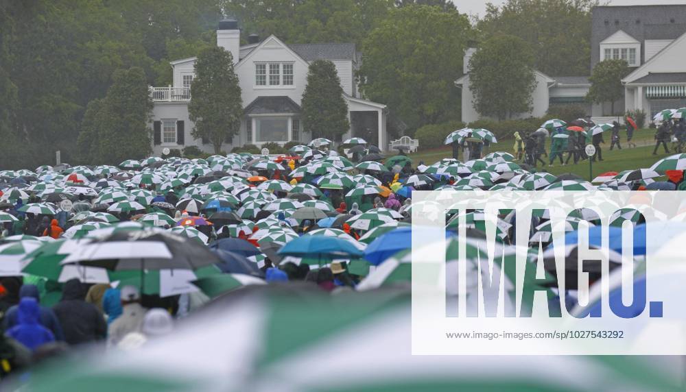 Golf: Masters Tournament Spectators leave the grounds after play was suspended for the day due to bad weather during the third round of the Masters Tournament at Augusta National Golf Club in Augusta, Georgia, on April 8, 2023. A14AA0001414709P