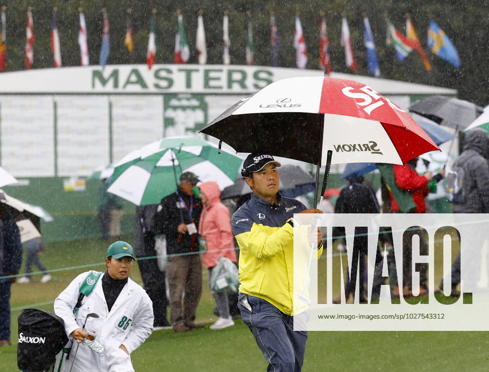 Golf: Masters Tournament Japan s Hideki Matsuyama walks with an umbrella during the third round of the Masters Tournament at Augusta National Golf Club in Augusta, Georgia, on April 8, 2023. A14AA0001414711P