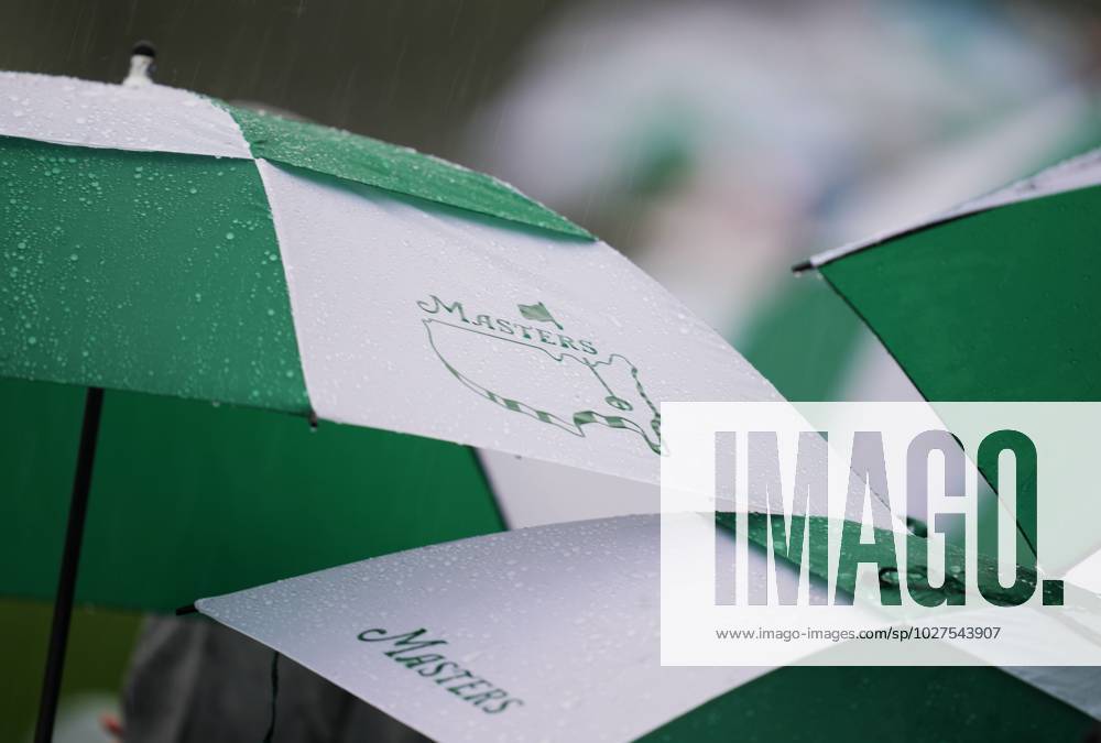 (230409) -- AUGUSTA, April 9, 2023 -- Audience watch the match in the rain during the second round of the 2023 Masters golf tournament at Augusta National Golf Club in Augusta, the United States, on April 8, 2023. ) (SP)U.S.-AUGUSTA-MASTERS-GOLF TOURNAMENT WuxXiaoling