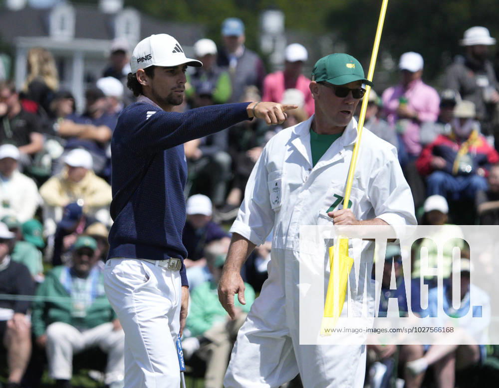 Joaquin Niemann looks over putt with caddie Gary Matthews on the 2nd hole during the final round at the 87th Masters tournament at Augusta National Golf Club in Augusta, Georgia on Sunday, April 9, 2023. AUG20230409203 BOBxSTRONG