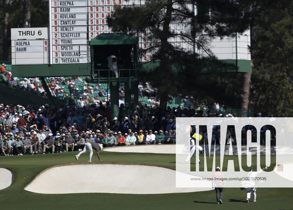 Jon Rahn (L) and Brooks Koepka arrive on the 7th green during the final round at the 87th Masters tournament at Augusta National Golf Club in Augusta, Georgia on Sunday, April 9, 2023. AUG20230409233 JOHNxANGELILLO