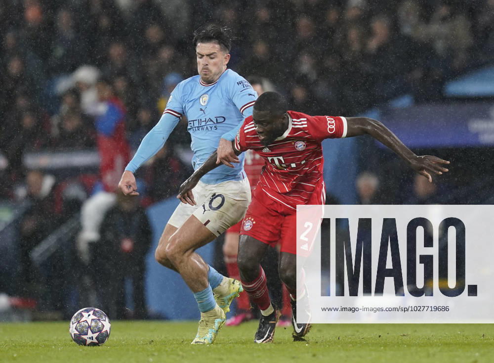Manchester, England, 11th April 2023. Jack Grealish of Manchester City pressure Dayot Upamecano of Bayern Munich during the UEFA Champions League match at the Etihad Stadium, Manchester. Picture credit should read: Andrew Yates Sportimage . SPI-2360-0070