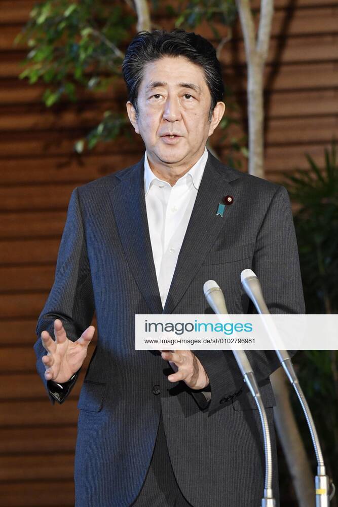 Japan PM Abe Japanese Prime Minister Shinzo Abe speaks to reporters at his office in Tokyo on July 31, 2020.