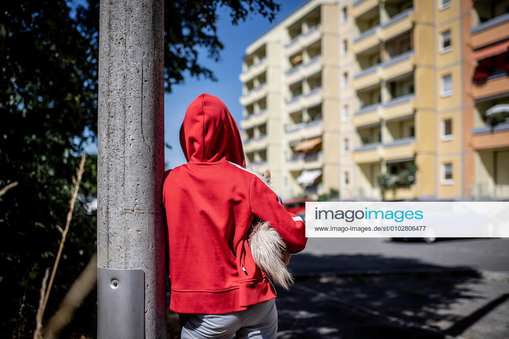 Leipzig Saxony , Gruenau district A child is standing in front of a prefabricated building in Leipzig Gruenau