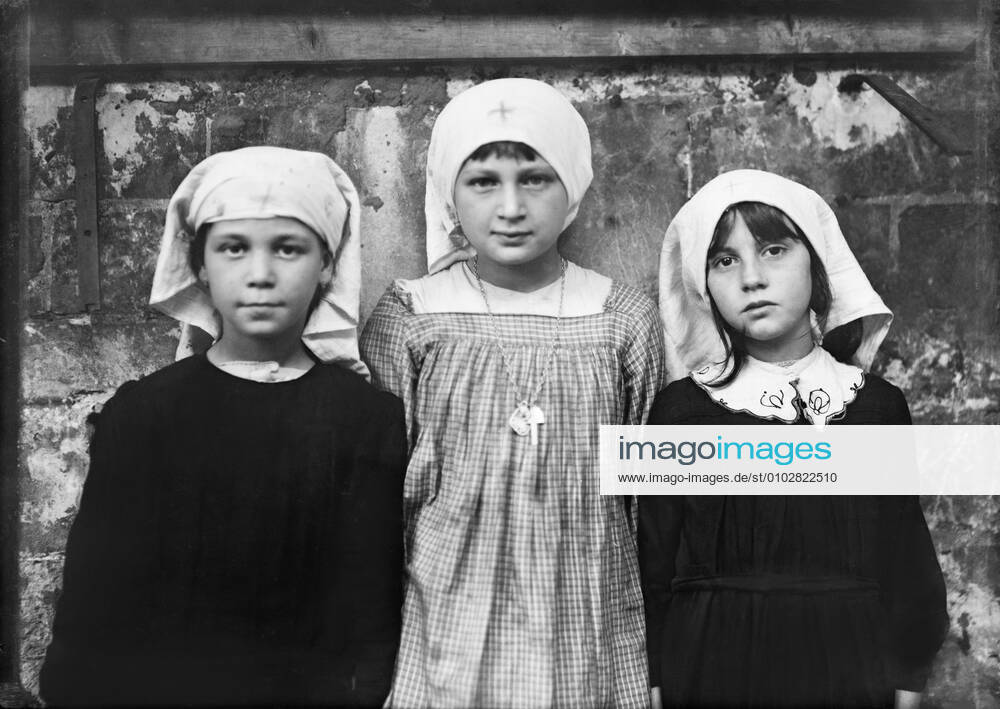 Three Refugee Children playing as Red Cross Nurses, St. Sulpice, Secours de Guerre, France, Lewis Wickes Hine, American National Red Cross Photograph Collection, August 1918 Secours De Guerre France - ZUMAg145 20200402_zza_g145_042