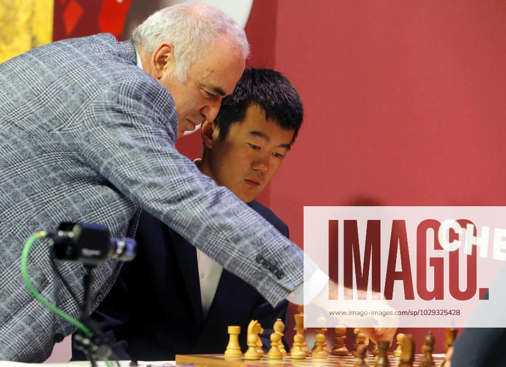 (230507) -- BUCHAREST, May 7, 2023 -- Former World Chess Champion, Garry Kasparov (L) of Russia, makes the first symbolic move for the round 1 match between Ding Liren of China and Maxime Vachier-Lagrave of France at Grand Chess Tour 2023 in downtown Bucharest, capital of Romania, May 6, 2023. (Photos by Xinhua) (SP)ROMANIA-BUCHAREST-CHESS-GRAND TOUR CristianxCristel