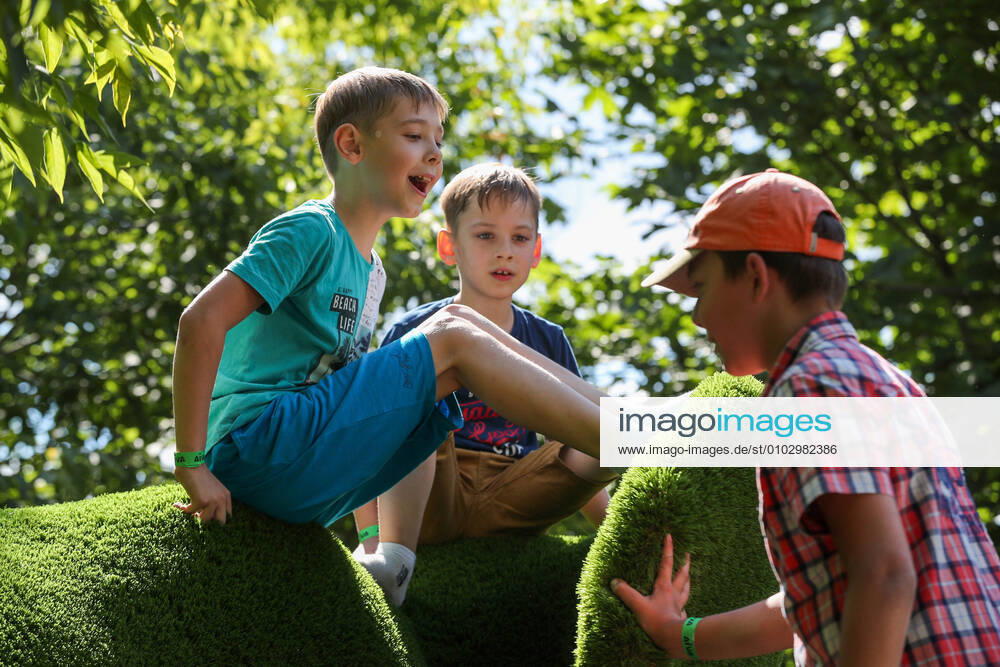 Children play by garden sculptures in Skazka family park. The sculptures consist of metal frames covered with artificial grass. Mikhail Tereshchenko TASS ; NO COMMERCIAL USE; NO ADVERTISING TS0E2B8A