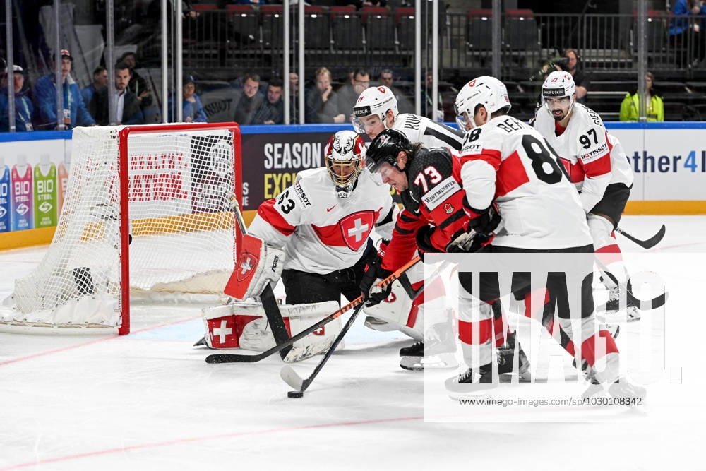 RIGA, LATVIA MAY 20 Tyler Toffoli of Canada tries to score against goalkeeper Leonardo Genoni of Switzerland during the 2023 IIHF Ice Hockey World Championship Finland Latvia game between Canada Switzerland at Arena Riga on May 20, 2023 in Riga, Latvia Riga Arena Riga Latvia