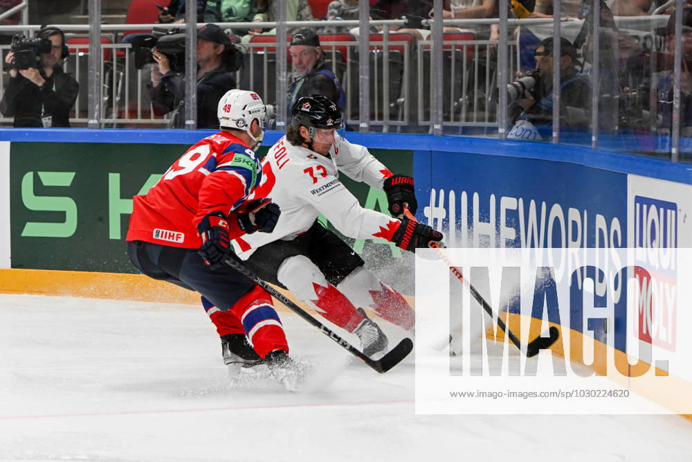 RIGA, LATVIA MAY 22 Tyler Toffoli of Canada and Christian Kaasastul of Norway battle for the puck during the 2023 IIHF Ice Hockey World Championship Finland Latvia game between Canada and Norway at Arena Riga on May 22, 2023 in Riga, Latvia Riga Arena Riga Latvia