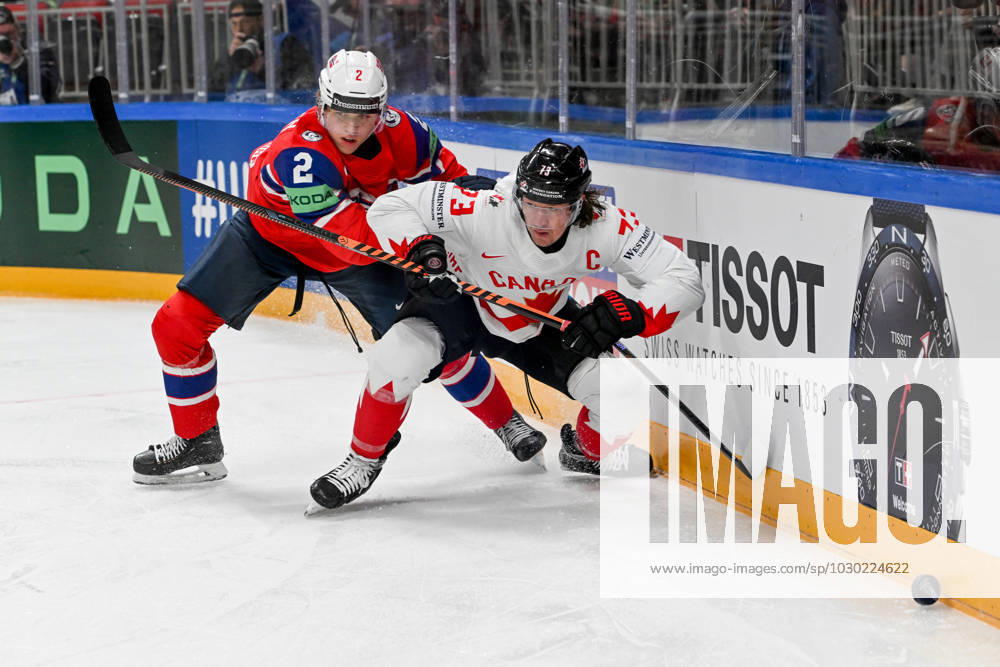 RIGA, LATVIA MAY 22 Tyler Toffoli of Canada battle for the puck against Isak Hansen of Norway during the 2023 IIHF Ice Hockey World Championship Finland Latvia game between Canada and Norway at Arena Riga on May 22, 2023 in Riga, Latvia Riga Arena Riga Latvia