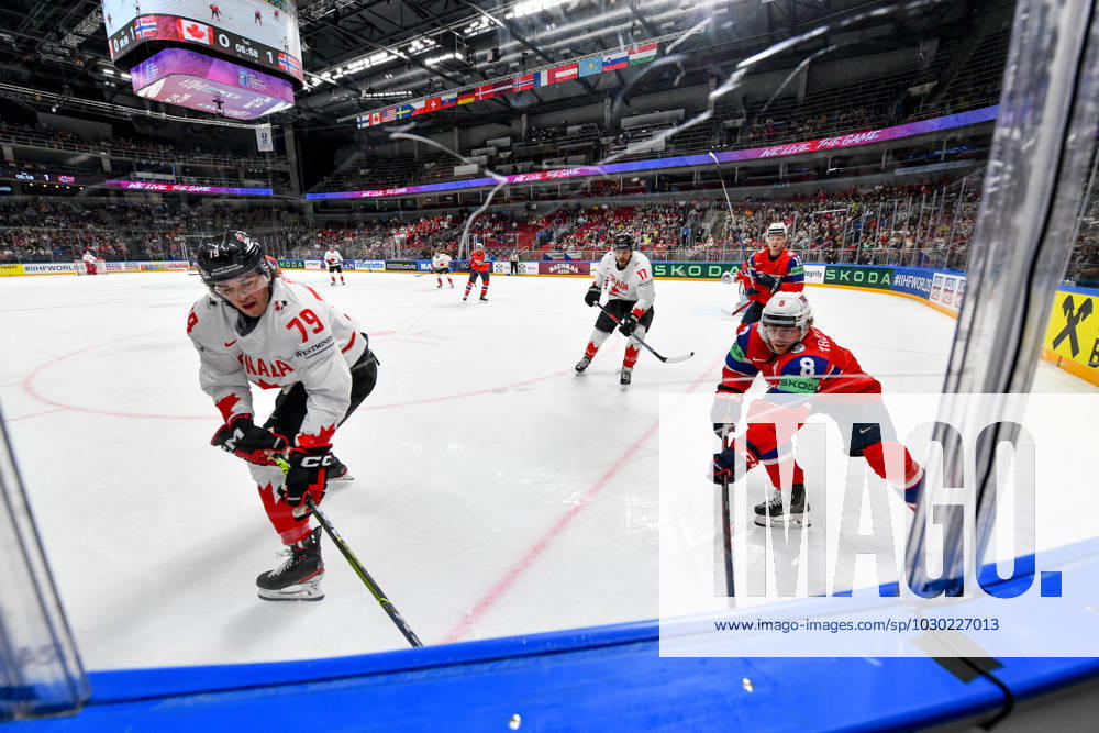 RIGA, LATVIA MAY 22 Samuel Blais of Canada fight with Mathias Trettenes of Norway for the puck possession during the 2023 IIHF Ice Hockey World Championship Finland Latvia game between Canada and Norway at Arena Riga on May 22, 2023 in Riga, Latvia Riga Arena Riga Latvia