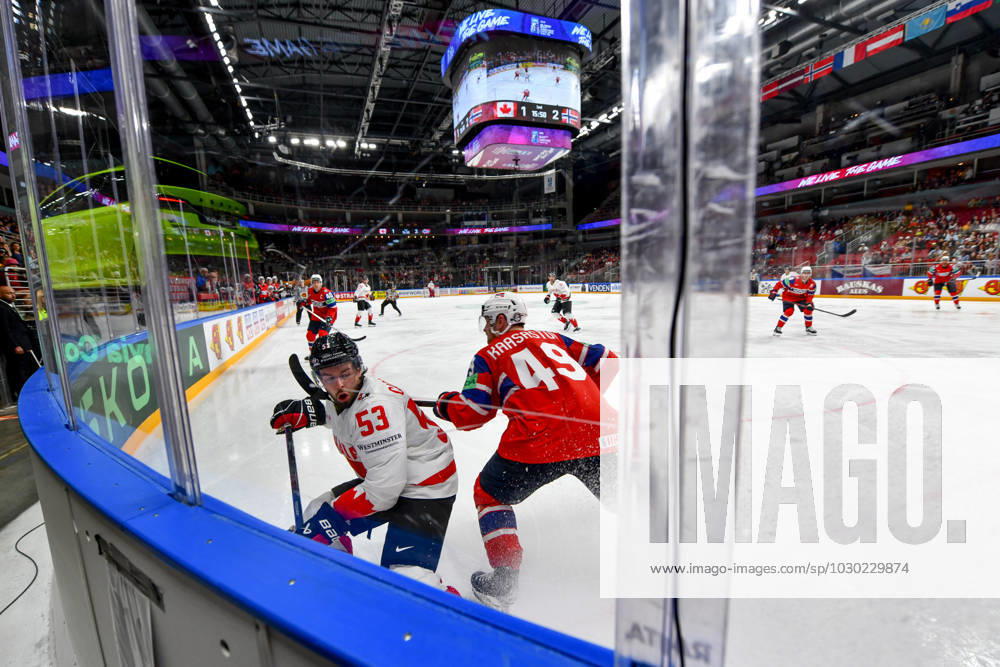 RIGA, LATVIA MAY 22 Michael Carcone of Canada battle along the boards against Christian Kaasastul of Norway during the 2023 IIHF Ice Hockey World Championship Finland Latvia game between Canada and Norway at Arena Riga on May 22, 2023 in Riga, Latvia Riga Arena Riga Latvia