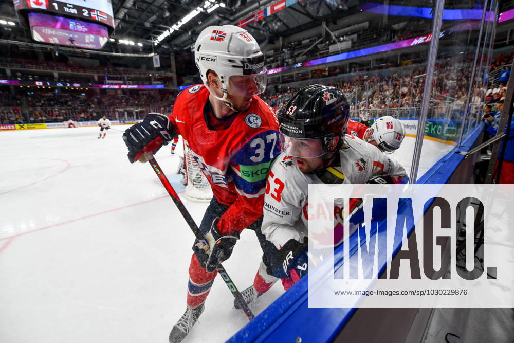 RIGA, LATVIA MAY 22 Michael Carcone of Canada and Markus Vikingstad of Norway battle along the boards during the 2023 IIHF Ice Hockey World Championship Finland Latvia game between Canada and Norway at Arena Riga on May 22, 2023 in Riga, Latvia Riga Arena Riga Latvia