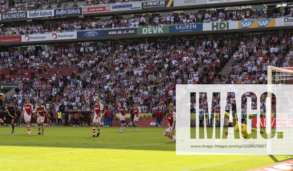 Football 1 Bundesliga 2022 2023, 34 Spieltag, 1 FC Köln FC Bayern München, Rhein Energie Stadion Köln, Goal shot for the decisive winning goal for the German championship in injury time by Jamal Musiala li, FC Bayern München , re goalkeeper Marvin Schwäbe Köln without a chance DFL and DFB regulations prohibit any use of photographs as image sequences and or quasi video