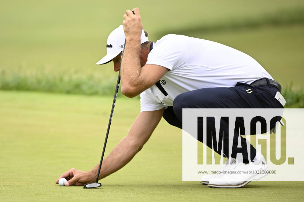 Dustin Johnson places his ball on the 17th green during the first round of the 2023 U.S. Open at the Los Angeles Country Club in Los Angeles on Thursday, June 15, 2023. McIlroy finished with a five-under par 65. LAP20230615234 ALEXxGALLARDO