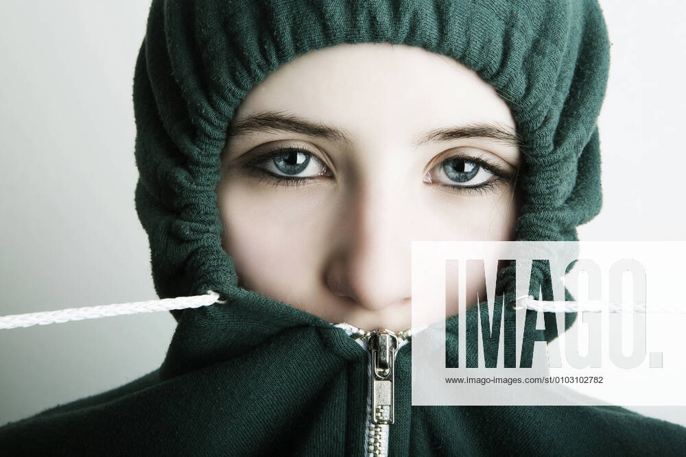 Germany, Cologne, Portrait of teenage girl wearing hooded top, close up model released Symbolfoto JAT000006