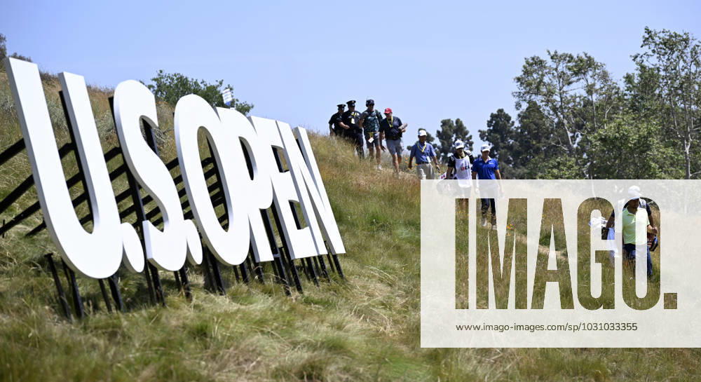 Xander Schauffele leads the pack of golfers and others down a path to the fourth hole during the second round of the 2023 U.S. Open Golf Championship at the Los Angeles Country Club in Los Angeles on Friday, June 16, 2023. LAP20230616236 ALEXxGALLARDO