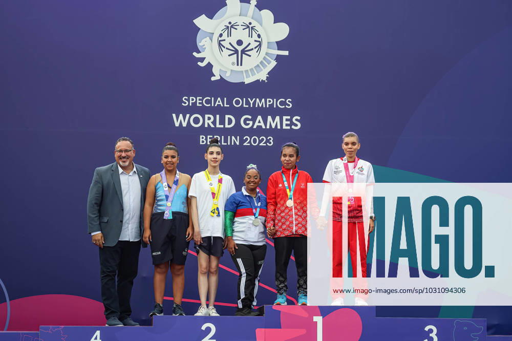 Athletes pose with U.S. Secretary of Education, Miguel A. Cardona during Rhythmic gymnastics, Rhythmische Sportgymnastik, RSG award ceremony during the Special Olympics Summer World Games Berlin 2023 in Messe conference centre. The 2023 Berlin Games will host 7000 athletes with learning disabilities from 190 countries. Special Olympics is an international charity which aims to include individuals with learning disabilities into the realm of olympic sports. Berlin 2023 is the biggest sporting as well as charitable event of 2023. Berlin Germany - ZUMAs197 20230618_zaa_s197_156