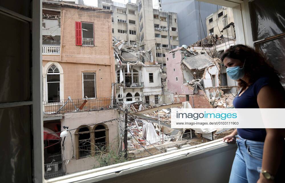 KW33 (200813) -- BEIRUT, Aug. 13, 2020 (Xinhua) -- A woman looks out from a window in Beirut, Lebanon, Aug. 13, 2020. Beirut s governor previously announced that 300,000 people have become homeless following the explosions with many of them unable to afford fixing their houses due to the financial crisis prevailing in the country and the loss of thousands of jobs. (Xinhua Bilal Jawich) TO GO WITH Feature: Thousands of Lebanese await reconstruction support after Beirut s blasts LEBANON-BEIRUT-BLASTS-RECONSTRUCTION