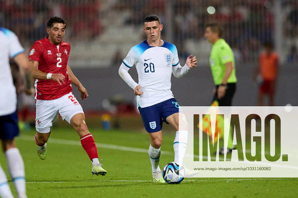 England national soccer team player Phil Foden passes the ball during the UEFA EURO, EM, Europameisterschaft,Fussball 2024 European qualifying soccer match between Malta and England at the National Stadium, Ta Qali, Malta, on 16 June 2023. Malta v England - UEFA EURO 2024 European Qualifier