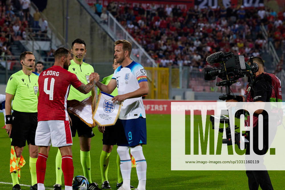 England national soccer team captain Harry Kane (R) shakes hands with Malta captain Steve Borg (L) ahead of the UEFA EURO, EM, Europameisterschaft,Fussball 2024 European qualifying soccer match between Malta and England at the National Stadium, Ta Qali, Malta, on 16 June 2023. Malta v England - UEFA EURO 2024 European Qualifier