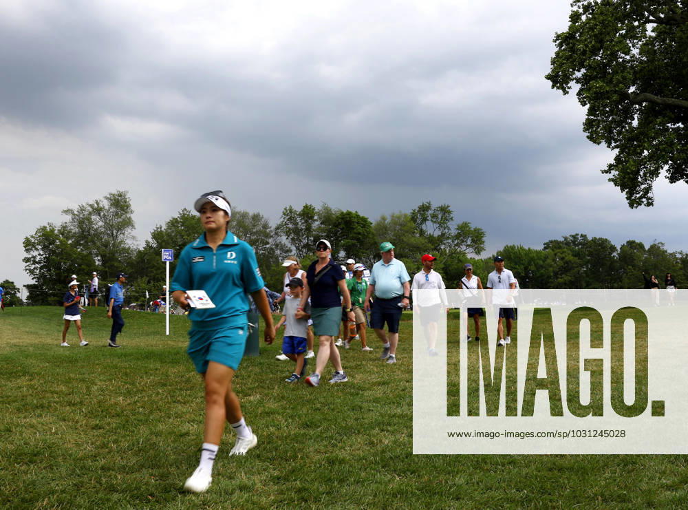 Jeongeun Lee of South Korea and spectators evacuate the golf course due to a weather warning with lightning already in the area in the final round of the KPMG Women s PGA, Golf Herren Championship at Baltusrol Golf Club in Springfield, NJ on Sunday, June 25, 2023. NYP20230625102 JohnxAngelillo