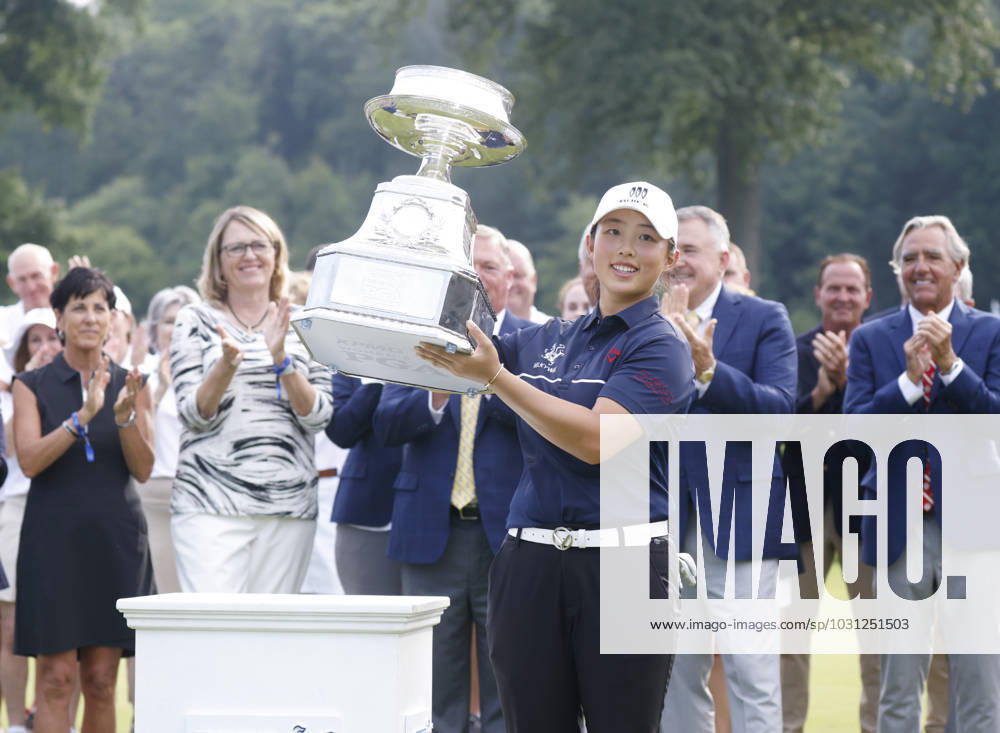 Yin Ruoning of China celebrates on the 18th green with the championship trophy in the final round after winning the KPMG Women s PGA, Golf Herren Championship with a score of 8 under par at Baltusrol Golf Club in Springfield, NJ on Sunday, June 25, 2023. NYP20230625107 JohnxAngelillo