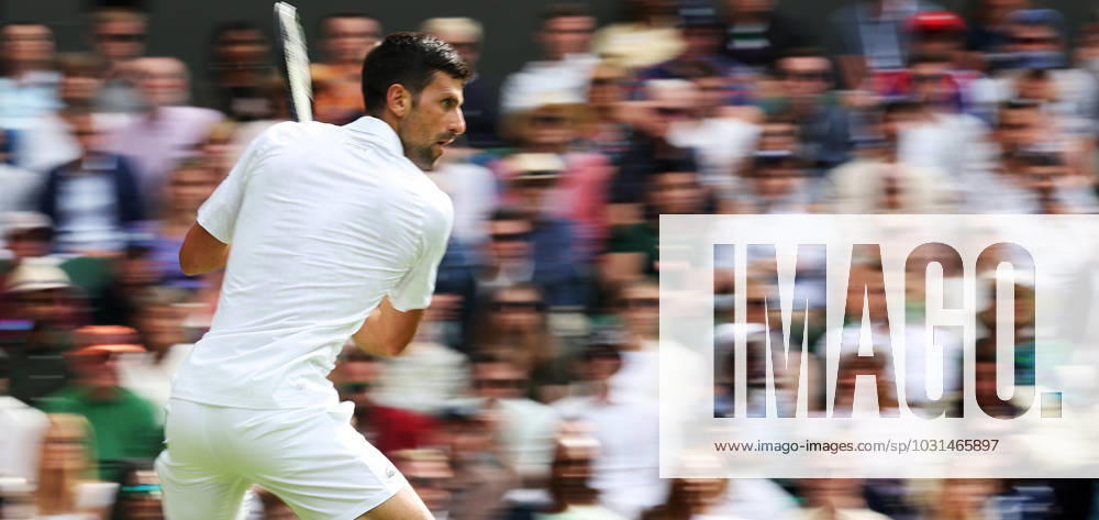 (230704) -- LONDON, July 4, 2023 -- Novak Djokovic of Serbia returns a shot during the men s singles 1st round match against Pedro Cachin of Argentina at Wimbledon Tennis Championship in London, Britain, on July 3, 2023. ) (SP)BRITAIN-LONDON-TENNIS-WIMBLEDON-DAY 1 LixYing