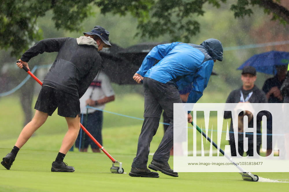DANA Open Groundskeepers push water off of the 8th green during rainshowers during the third round of the Dana Open golf tournament at Highland Meadows Golf Club in Sylvania, Ohio USA, on Saturday, July 15, 2023. Sylvania Ohio United States
